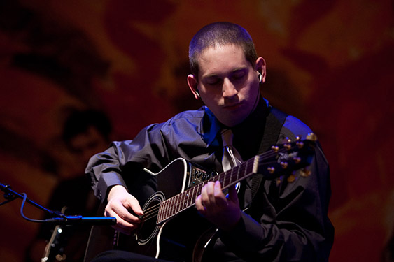 Gerd Henkel playing an acoustic guitar